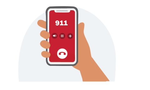 A hand holding a phone calling 911.